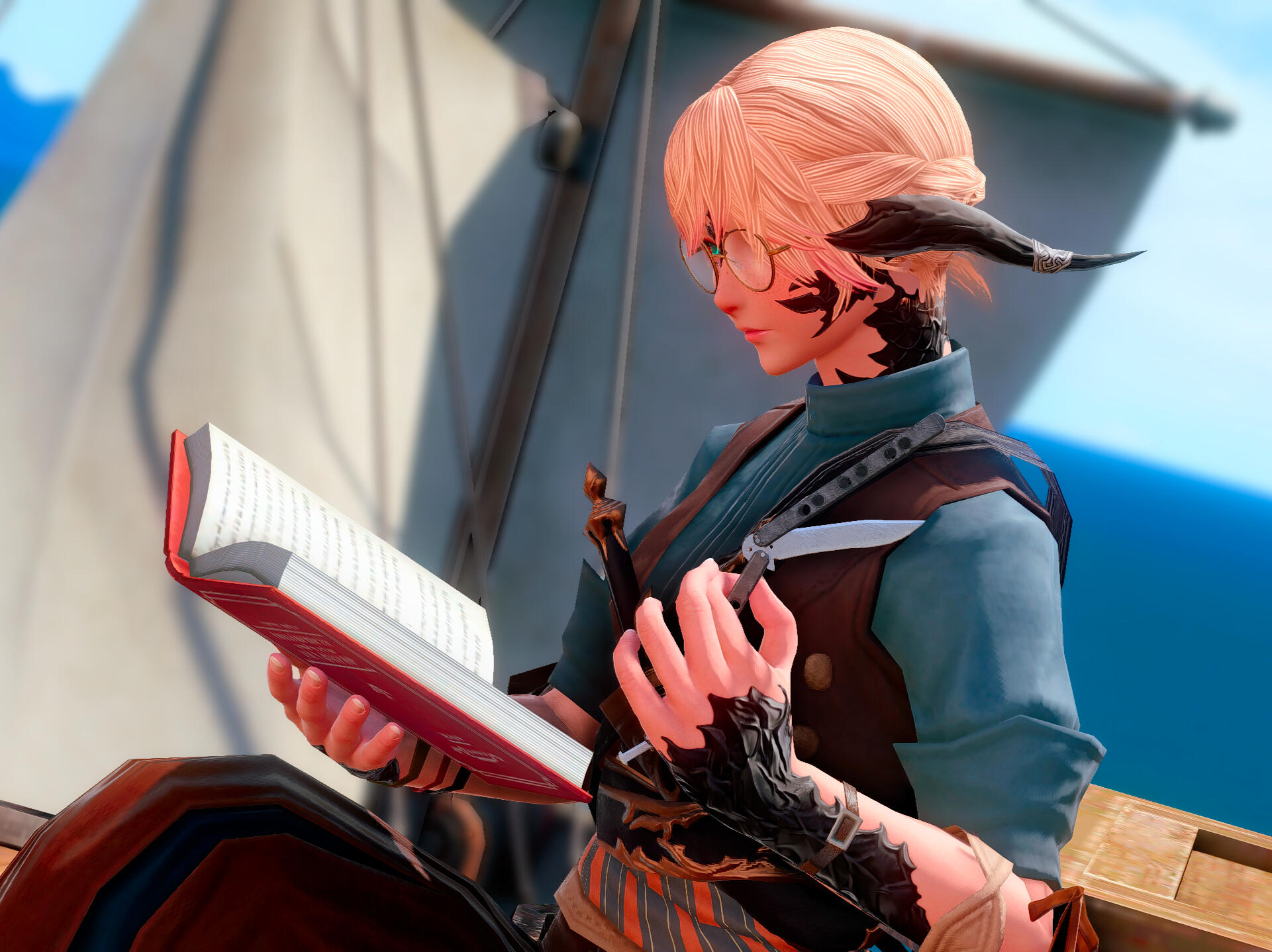 Alma reading with a butterfly knife